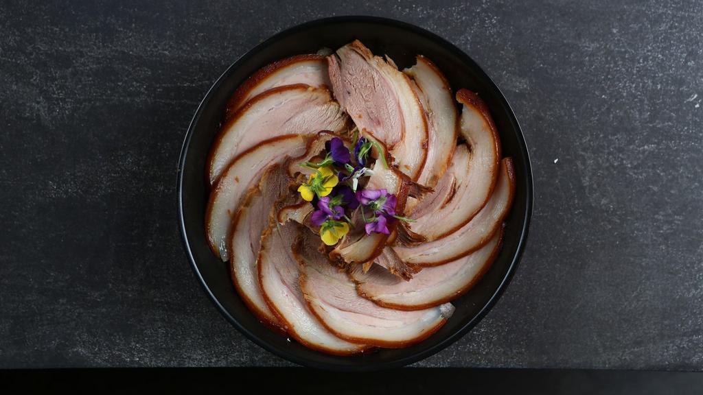 Braised Pork · Sliced braised pork with homemade sauce on the side.
