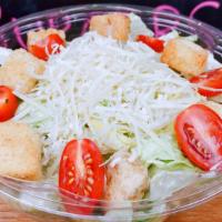 Caesar Salad · Romaine lettuce, dressed with Caesar dressing, cherry tomatoes, croutons and grated Parmesan...