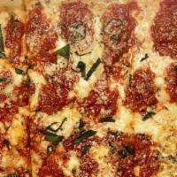 Grandma Pizza · Thin Sicilian crust brushed with olive oil and garlic, fresh mozzarella, and spotted with ch...