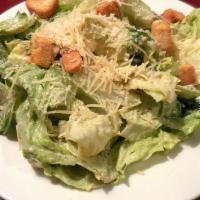 Caesar Salad · Romaine lettuce, red onion, and croutons grated cheese with Caesar dressing on the side.