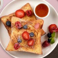 Halle Berry French Toast · Fresh bread battered in egg, milk, and cinnamon cooked until spongy and golden brown. Topped...