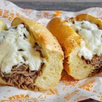 Cheesesteak · Sliced ribeye steak, melted cheese, hoagie roll.