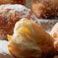 Croissant Beignet · Our Croissant Beignet is a flaky spin on the traditional beignet. As a feature in homestyle ...