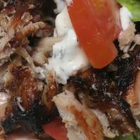Chicken Doner Sandwich · Marinated chicken vertically roasted. Served with lettuce, tomato, onions and tzatziki sauce.