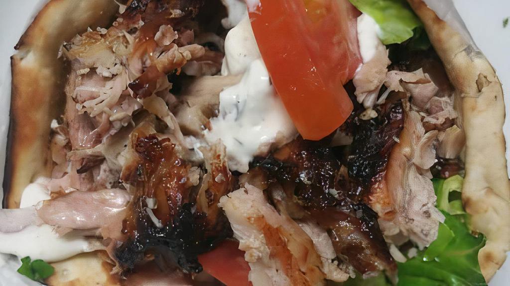 Chicken Doner Sandwich · Marinated chicken vertically roasted. Served with lettuce, tomato, onions and tzatziki sauce.