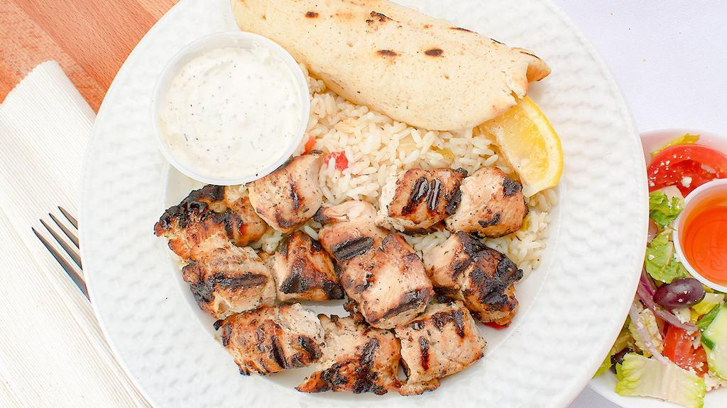 Chicken Souvlaki Platter · Marinated grilled chicken cubes. Served with Greek salad or soup and choice of rice, lemon potatoes or French fries. Includes tzatziki and pita bread.