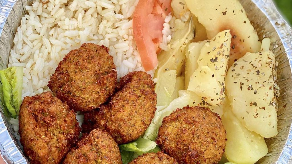 Falafel Platter · Croquettes of spicy ground chickpeas and tahini sauce. Served with Greek salad or soup and choice of rice, lemon potatoes or French fries. Includes tzatziki and pita bread.