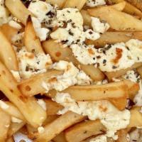 Greek Fries · French fries topped with feta cheese and oregano.