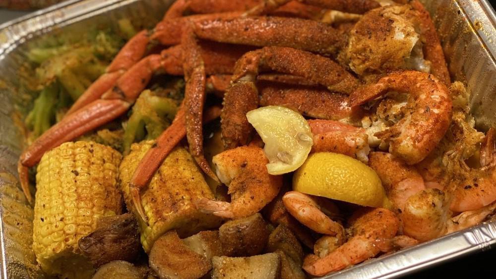 Combo B · 1/2 lb. of shrimp and 1 cluster of snow crab comes with red potatoes, 2 pieces of corn, and broccoli.