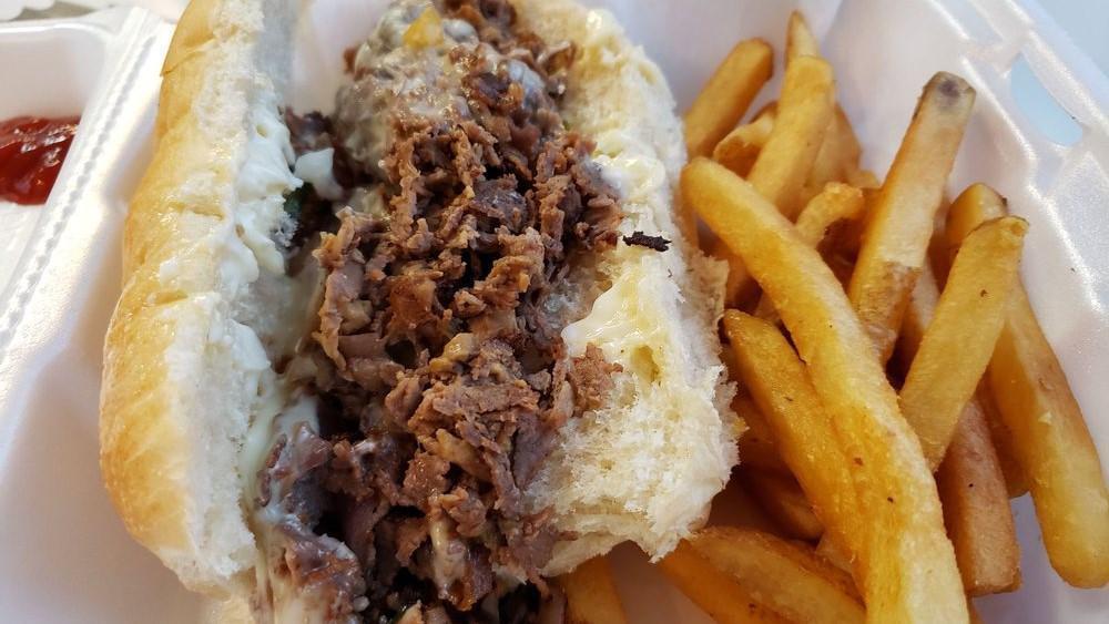 Steak And Cheese Sub · Mushrooms, peppers, onions, and mozzarella cheese. Served with French Fries.