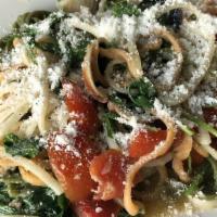 Linguine Tre Colori · Fresh linguini tossed with cockles, crab meat, arugula, cherry tomatoes, and garlic in a whi...
