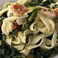 Tagliatelle Con Broccoli Rabe & Gamberoni · Broccoli rabe and jumbo shrimp sautéed in garlic, oil and white wine, served over fresh tagl...