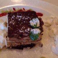 Tiramisu · Traditional pick me up dessert. Espresso sponge cake layered with a cocktail of cream, elega...