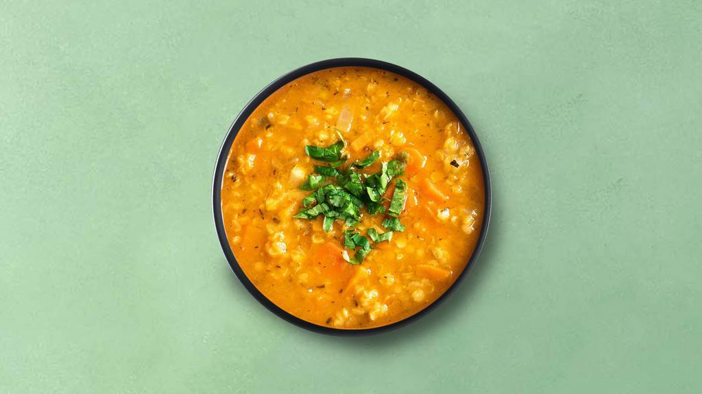 Classic Yellow Lentils · Slow-cooked lentils, tempered with whole and ground spices, onions, tomatoes, and herbs. Served with a side of aromatic white rice.