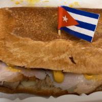Cuban Sandwish · Sliced roasted pork, ham, cheese, mustard, dill pickles, cheese, hot pressed.