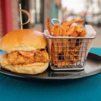 Louisiana Buttermilk Fried Chicken Sandwich · Cabbage slaw, iNINE tangy sauce.