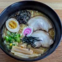 Miso Ramen · Wavy noodles in our special miso broth topped with braised pork belly, scallions, bamboo sho...