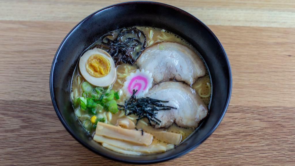 Miso Ramen · Wavy noodles in our special miso broth topped with braised pork belly, scallions, bamboo shoots, corn, nori, fish cake and half boiled egg.