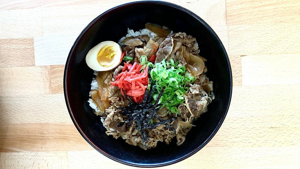 Beef Gyudon Rice Bowl · Simmered thinly sliced beef and onion in special soy sauce, ginger and scallion and boiled egg over rice.