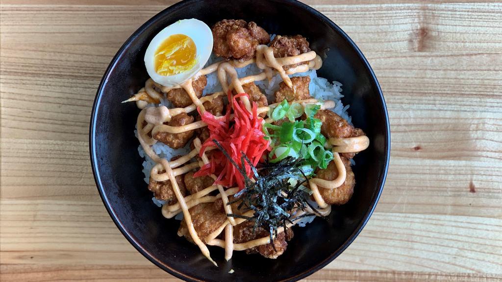 Chicken Karaage Rice Bowl · Asian style chicken nugget seasoned with ginger, garlic, soy sauce, together with half boiled egg, scallion on top of white rice.
