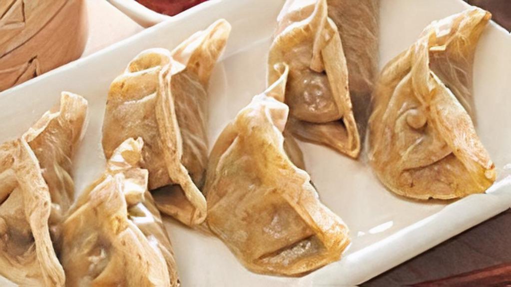 Veg Dumplings · Steamed minced vegetables tossed with onions and served with soy sauce.