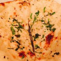 Garlic Naan · Bread made from fermented dough flavored with garlic flakes coriander.