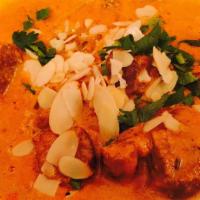 Goat Or Lamb Korma · Cubes of meat mildly spiced cooked with yogurt, nuts and creamy sauce.