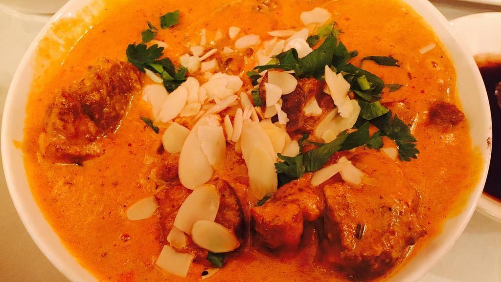 Goat Or Lamb Korma · Cubes of meat mildly spiced cooked with yogurt, nuts and creamy sauce.