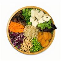 Vegan Temple Tofu · Roasted sesame tofu, mesclum, shredded kale, warm herbed brown rice, red cabbage,  carrot, e...
