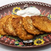 Deruny · Potato pancakes served with sour cream.