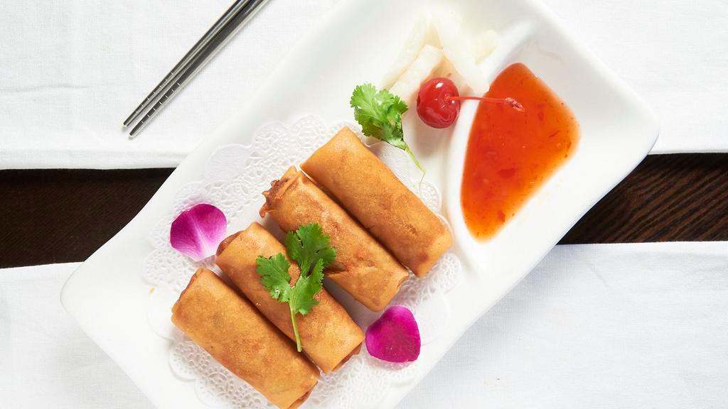 Spring Roll · Spicy yellowtail and crunch inside, topped with yellowtail and scallion.