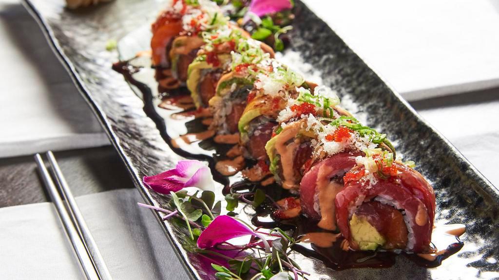 Kamikaze Roll · EIght pieces. Tuna, salmon and avocado inside, topped with tuna, salmon, eel, tempura crunch, tobiko, scallion with spicy mayonnaise and eel sauce.