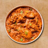 Classic Chicken Tikka Triumph · Cubes of tenders chicken prepared in tomato sauce and cream with Indian spices. Served with ...