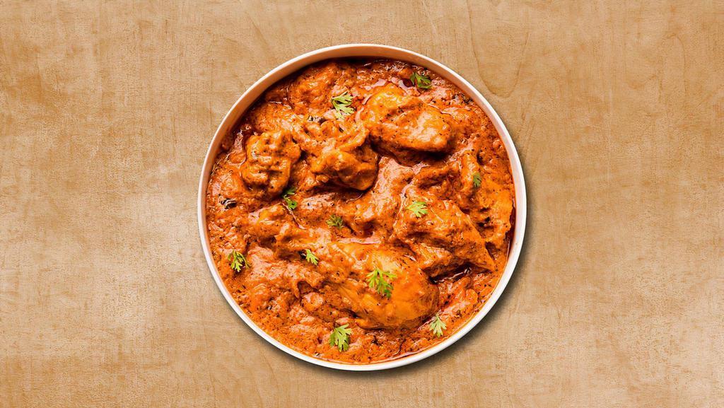 Classic Chicken Tikka Triumph · Cubes of tenders chicken prepared in tomato sauce and cream with Indian spices. Served with a side of our aromatic basmati rice.