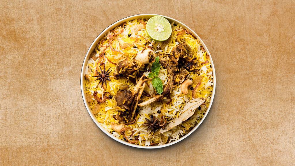 Goat Biryani Theory · Aromatic rice cooked with pieces of goat, Indian spices, and herbs. Served with lightly spiced curry and raita.