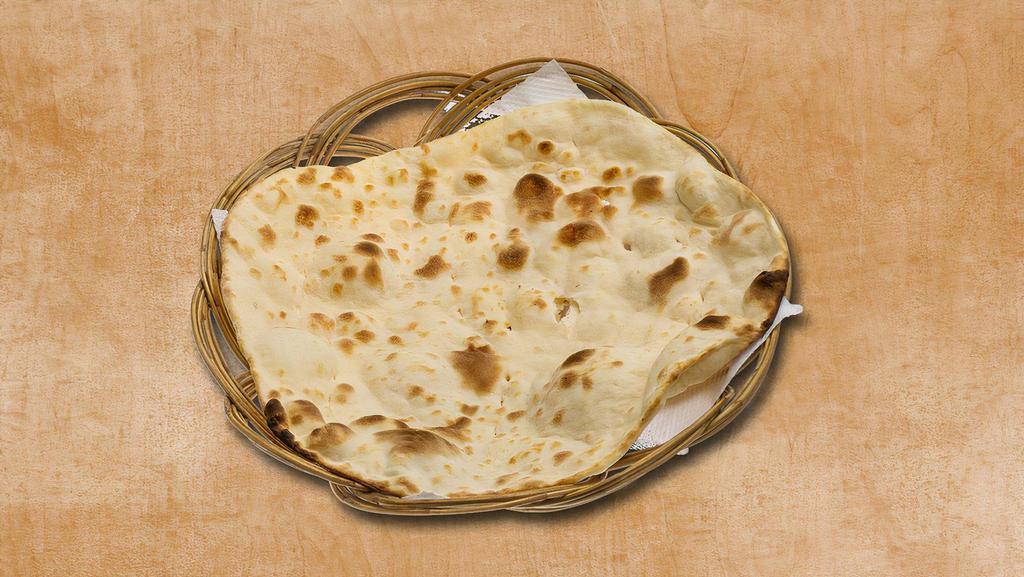 Simple Naan · Freshly made dough baked in an authentic Indian oven.