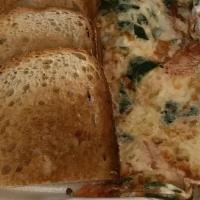 Mediterranean Omelette · Three eggs whites, spinach, tomatoes, Feta cheese and a choice of toast