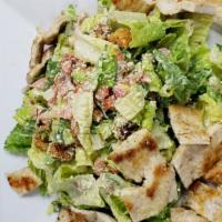 Mexican Caesar Salad · Cilantro, romaine lettuce, croutons, tomato, and onion with Mexican Caesar dressing.