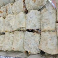 Burrito · Flour tortilla with choice of meat, rice, beans, Monterey cheese, cream, Cotija cheese, lett...