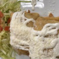 Chimichangas · Two fried flour tortillas, filled with choice of meat and Monterey cheese, topped with cream...