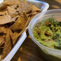 Guacamole & Chips · Hass avocados, jalapeños, onions and cilantro. Served with golden tortilla chips and salsa.