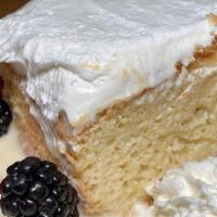 Tres Leches Cake · House made, topped with whipped cream