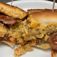 The Mustang · Taylor ham, bacon, house-made pork sausage, scrambled eggs, cheese & house-made home fries o...