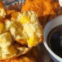 Corn Fritters · 6 housemade fritters loaded with sweet corn - served with table syrup for dipping