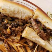 Cheesesteak Sandwich · House-made steak with American cheese, mushrooms, onions & peppers on a sub roll