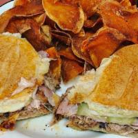 Cuban Sandwich · GRUB FAVORITE! Juicy house-made shredded mojo pork, sliced ham, Swiss, pickles, & housemade ...
