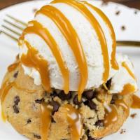 Warm Chocolate Chip Cookie · olive oil cookie, vanilla ice cream, caramel (in house only)