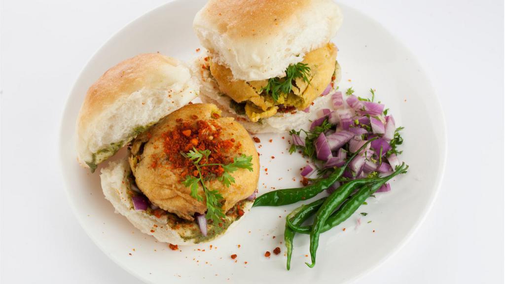 Vada Pao (2 Pcs) · Fried seasoned potato balls served in a bun with tangy sweet and spicy chutney.