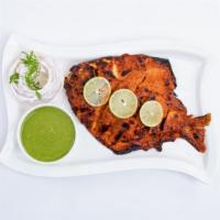 Tandoori Pomfret · Whole Indian fish marinated in spiced yogurt sauce cooked in the clay oven.