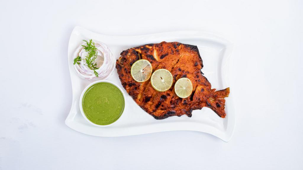 Tandoori Pomfret · Whole Indian fish marinated in spiced yogurt sauce cooked in the clay oven.